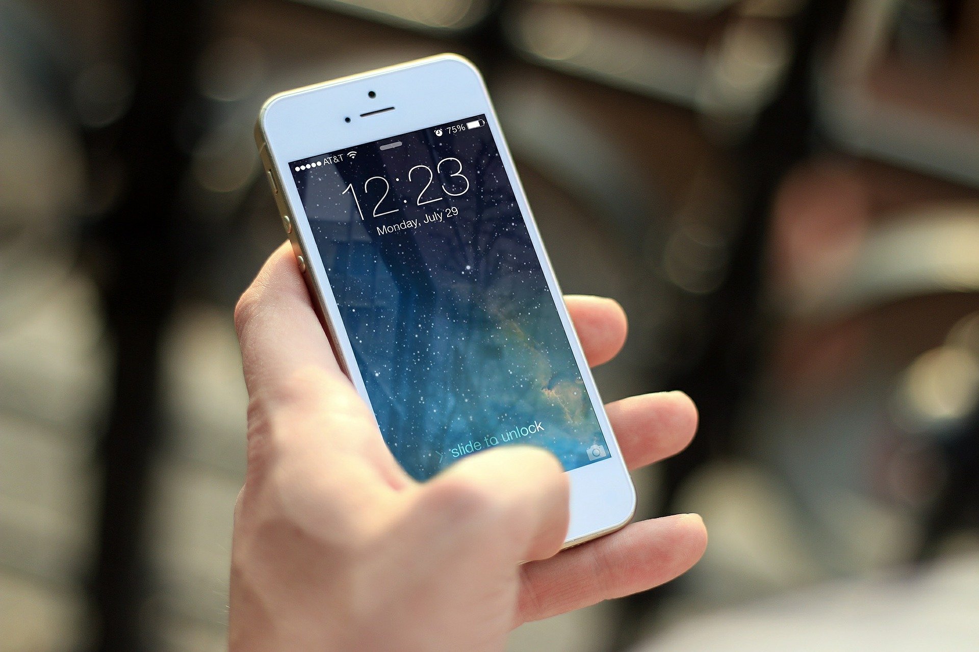 man-holding-apple-android-smartphone