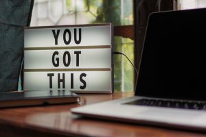 you-got-this-sign-next-to-new-laptop-computer