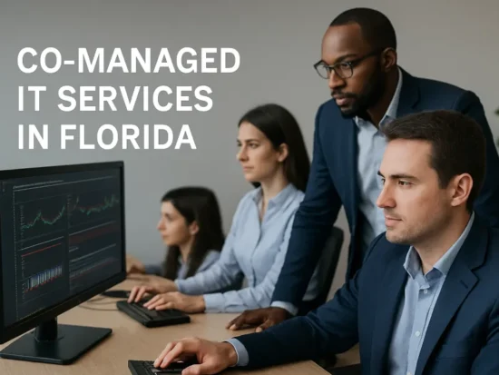 IT professionals monitoring network systems and collaborating in a Florida office for co-managed IT services.