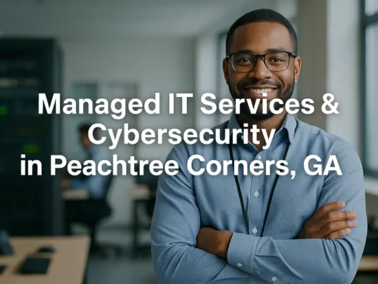 Professional IT technician standing confidently in a modern office with overlaid text reading "Managed IT Services in Peachtree Corners, GA".