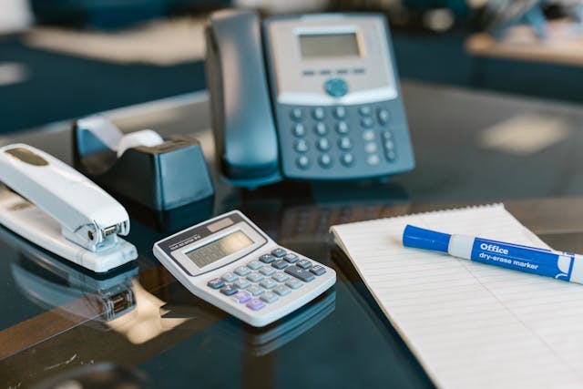 Business team using VoIP phone system and cloud communication technology in Georgia office.