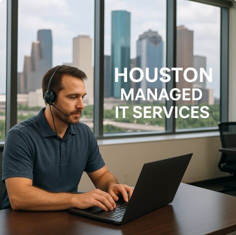 "IT professional wearing a headset working on a laptop in a modern Houston office with downtown skyline in the background and the text 'Houston Managed IT Services' overlaid on the image."