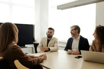 A client prospect meeting with IT consulting professionals.